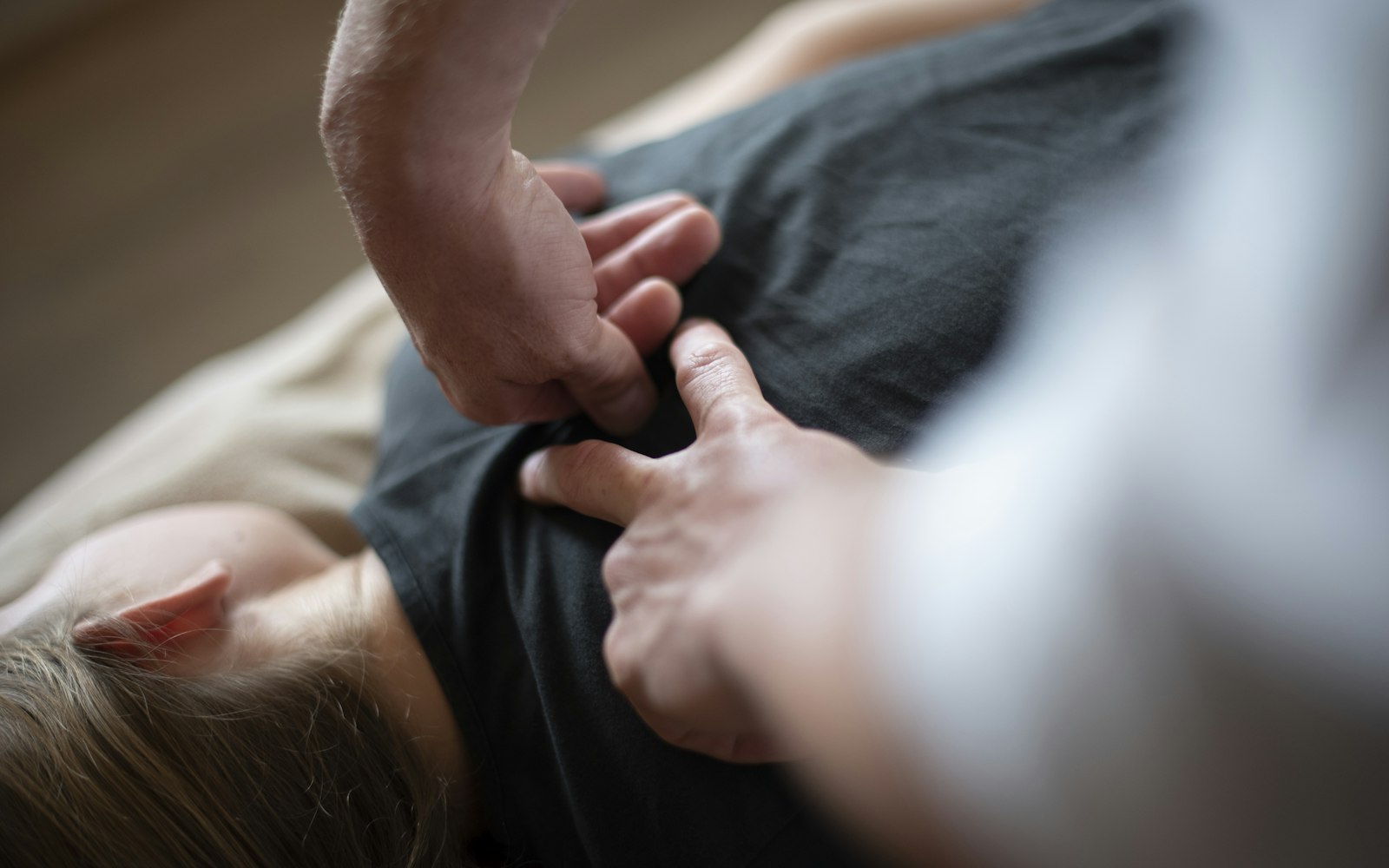 A chiropractor performing a spinal adjustment